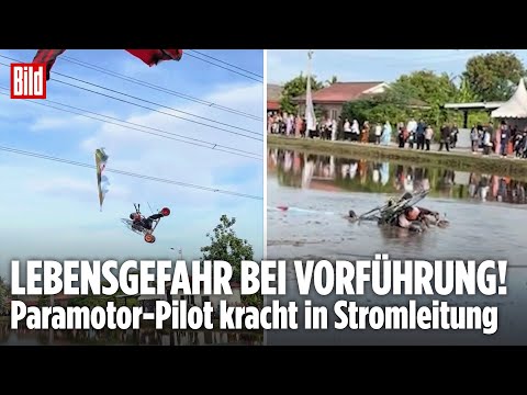 DRAMATISCHER UNFALL: Paramotor-Pilot kracht in Stromleitung – Dann stürzt er ins Reisfeld