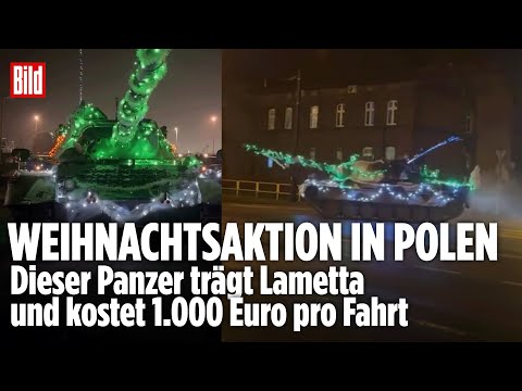 LICHTERKETTE STATT TARNNETZ: Weihnachts-Panzer rollt durch polnische Stadt