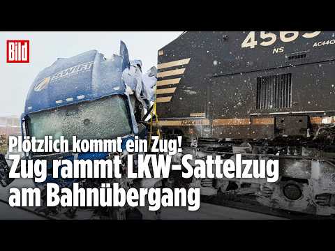Zug rast durch Schneesturm: LKW-Sattelzug bleibt in Schienen stecken